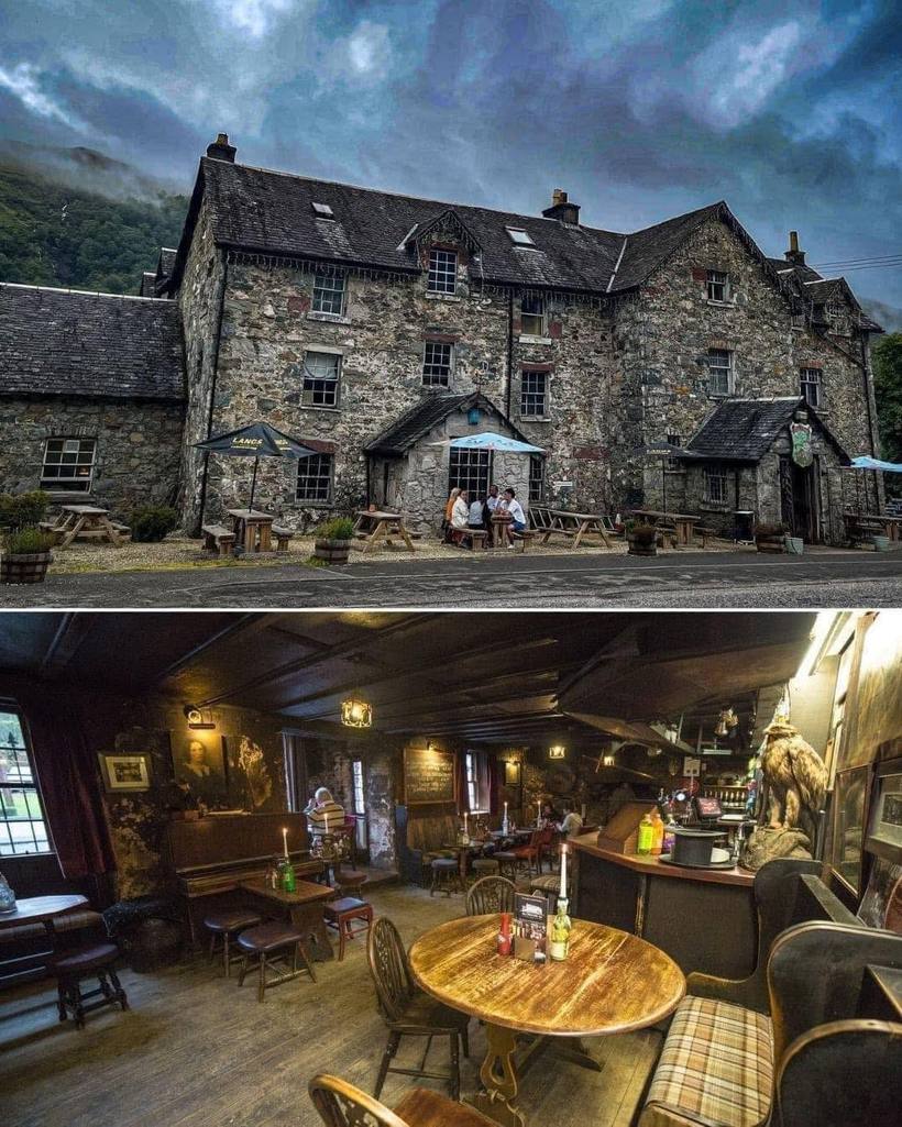 The stone frontage of a centuries-old Highland inn beneath cloud